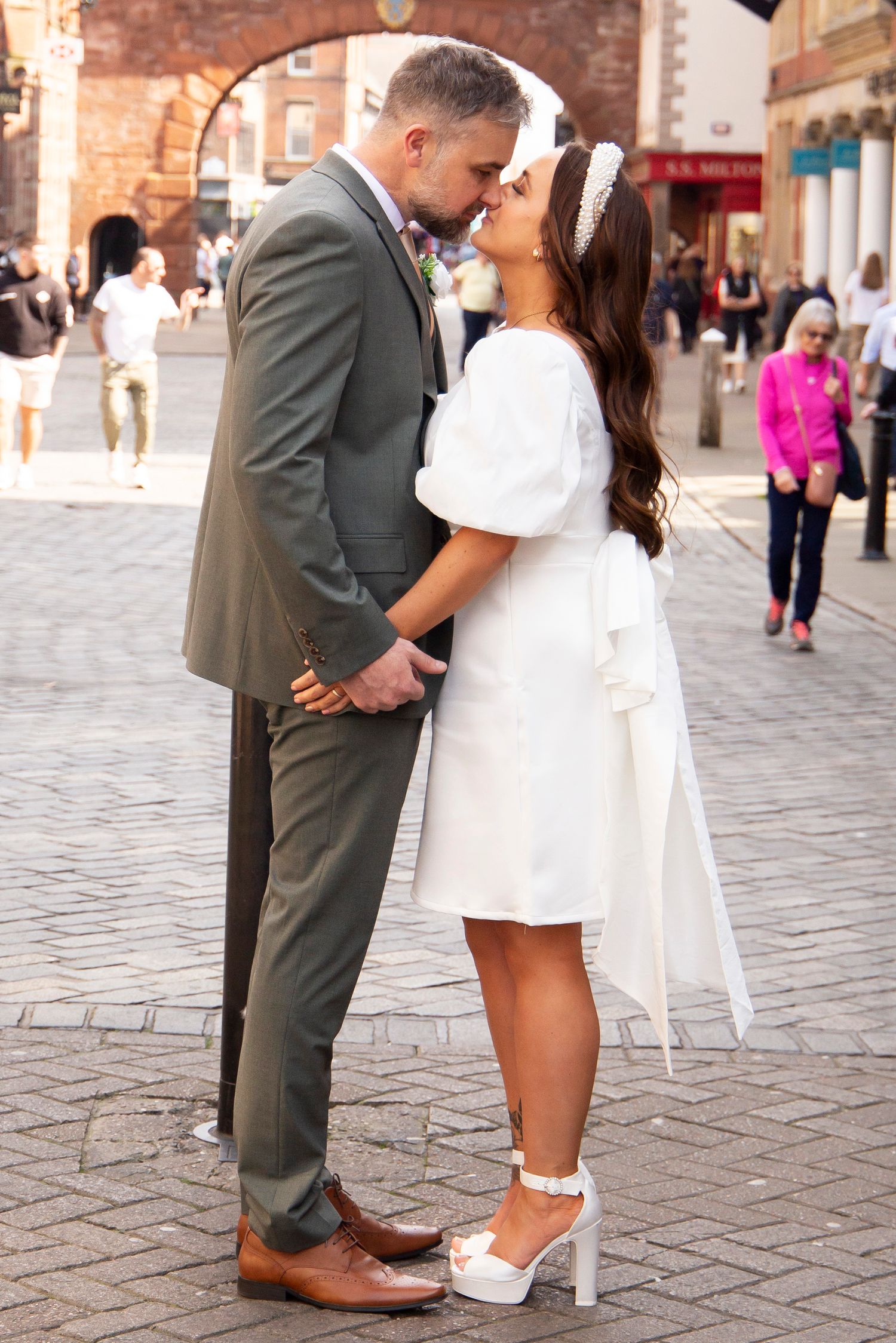 Bride and groom kissing in Chester city centre wedding