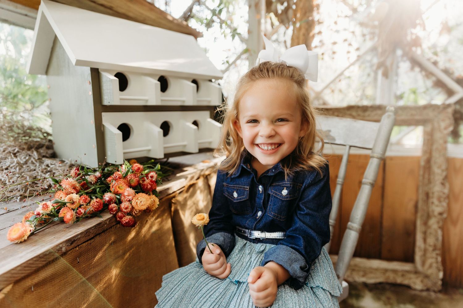 Little girl in greenhouse at The Barn at High Point Farms in North Georgia, photographed by Urso Photography.