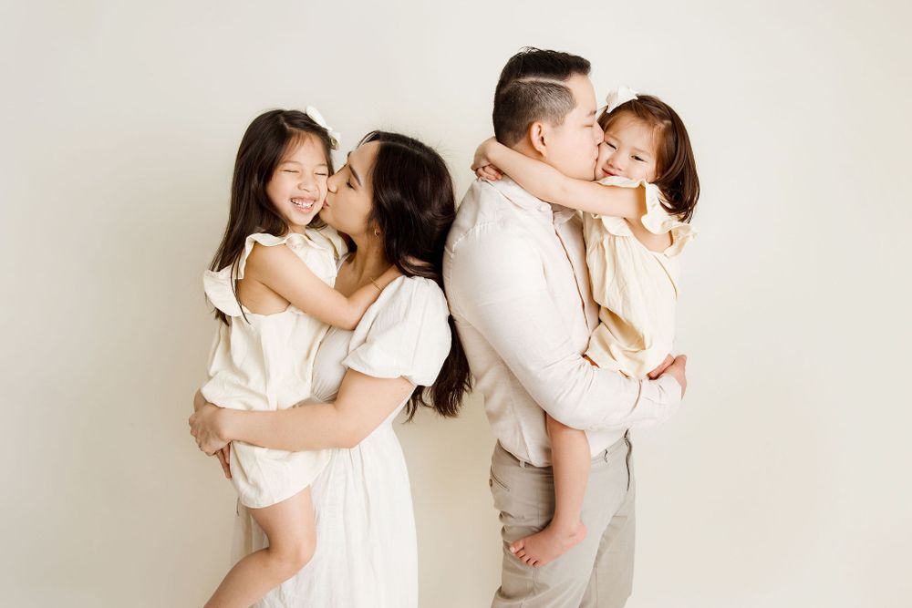 Mom, dad and two children family photo