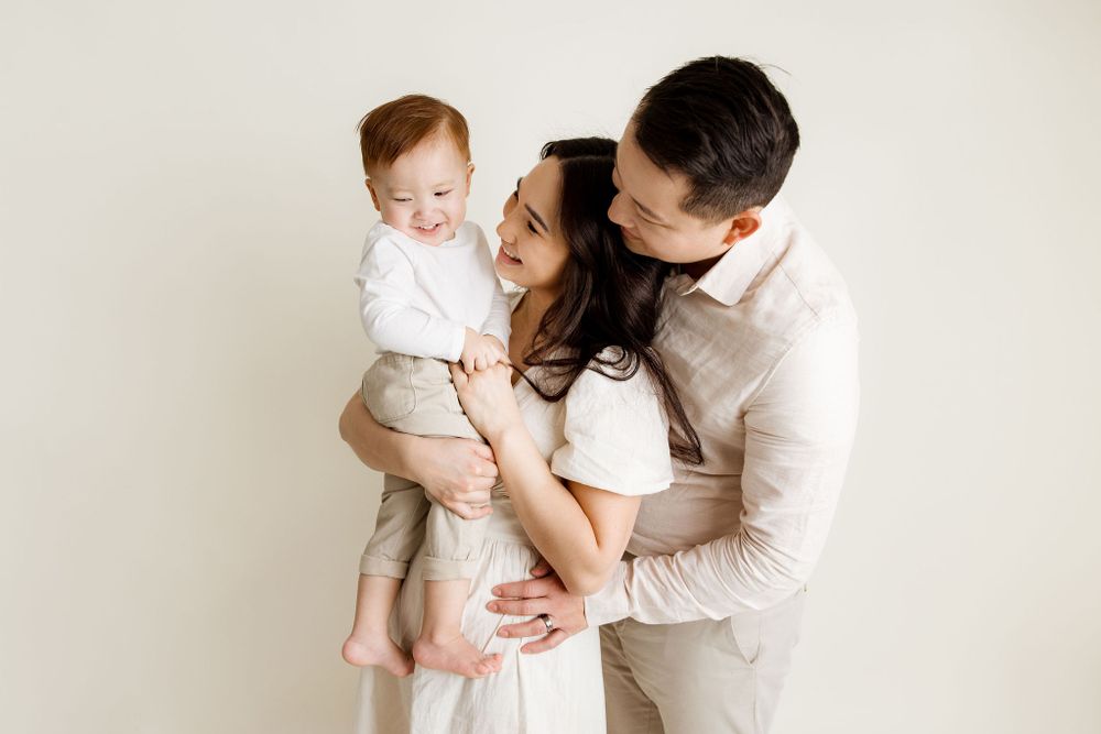 Mom and dad playing with their toddler