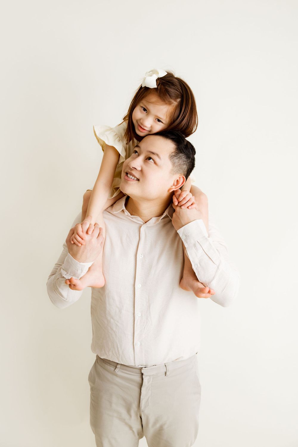 Father daughter moment during a studio family session,