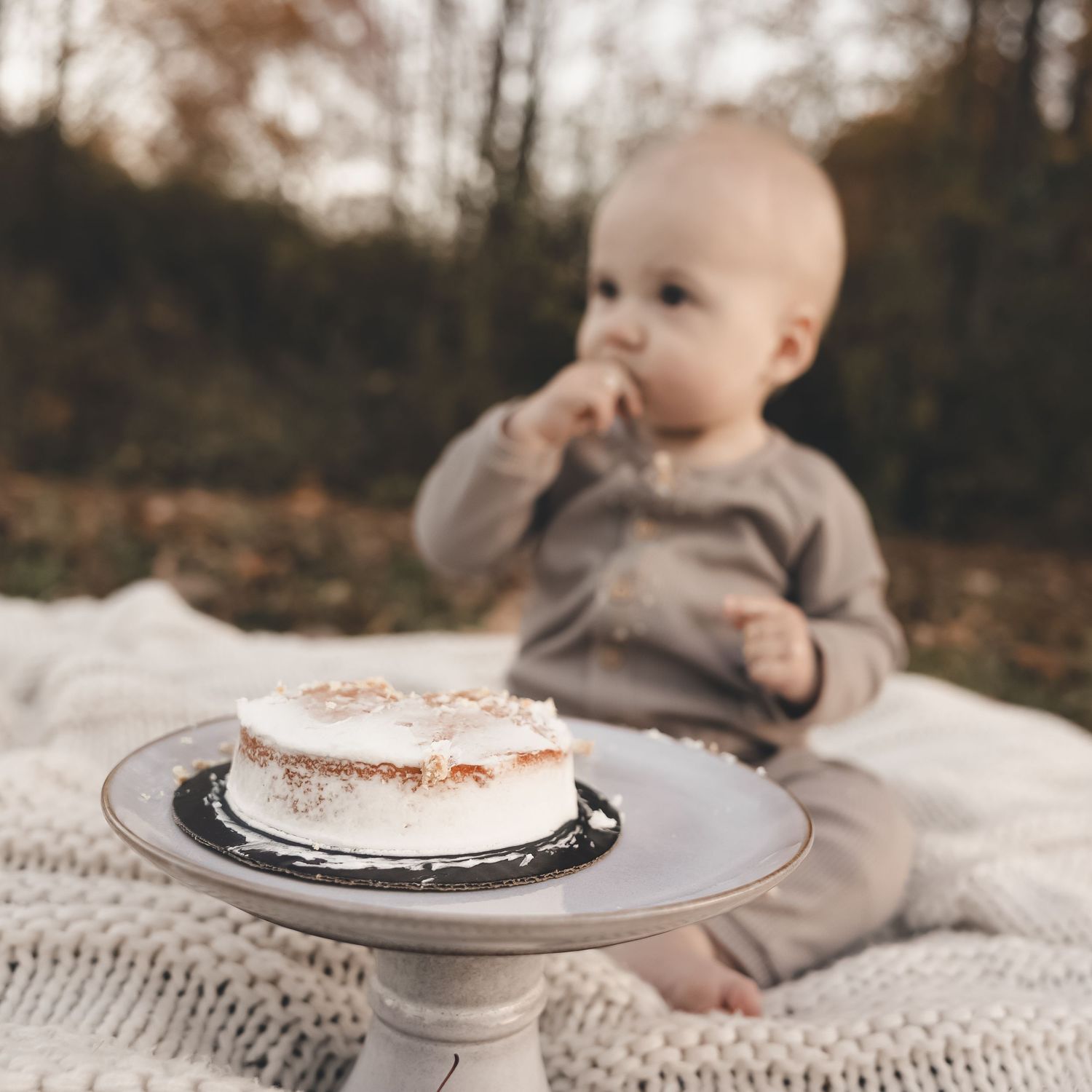First birthday cake smash in Northeast Ohio. Natural, candid baby milestone photography capturing pure joy and timeless memories.