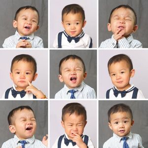 A collage of nine photos showing a cute toddler boy in a blue tie displaying various facial expressions from happy to crying.