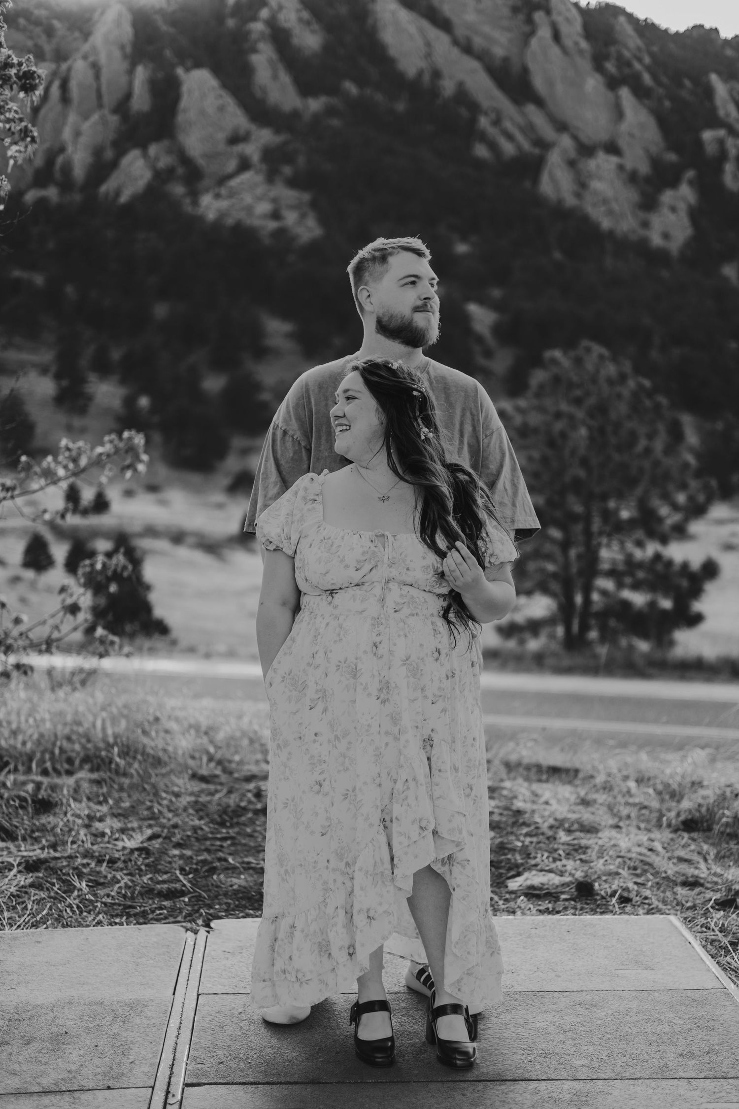 Black and white photo of a couple embracing outdoors with rocky mountain | Couple Photos in Boulder, Colorado