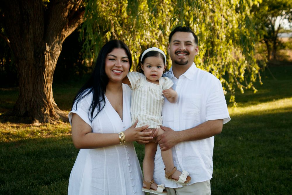 A family of three during a family photo session at Willow Tree Park in Canyon, Texas
