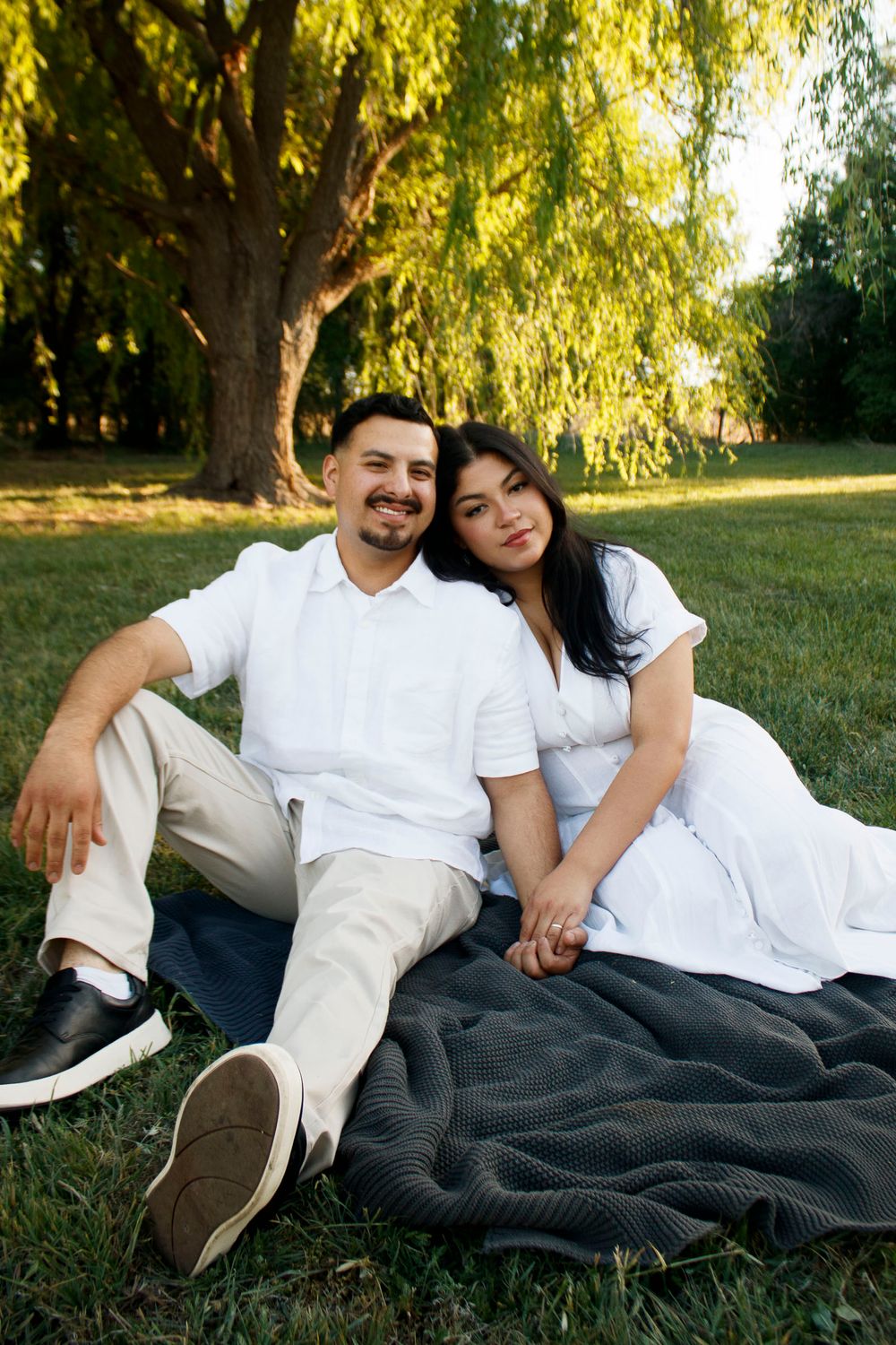 A couple during a family photo session at Willow Tree Park in Canyon, Texas