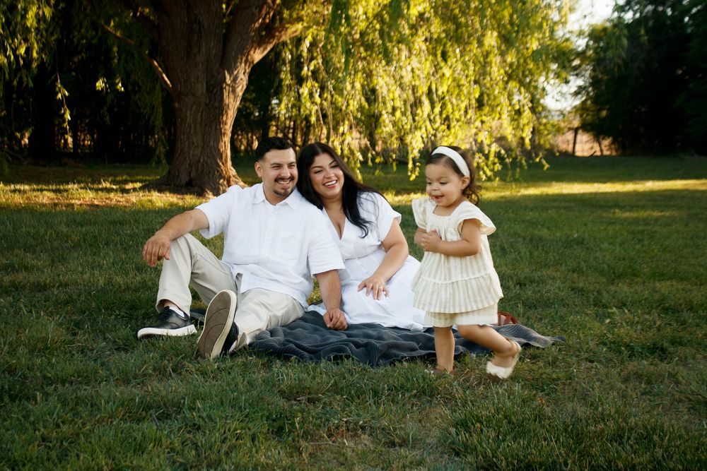 A family of three during a family photo session at Willow Tree Park in Canyon, Texas
