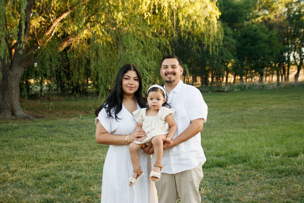 A family of three during a family photo session at Willow Tree Park in Canyon, Texas