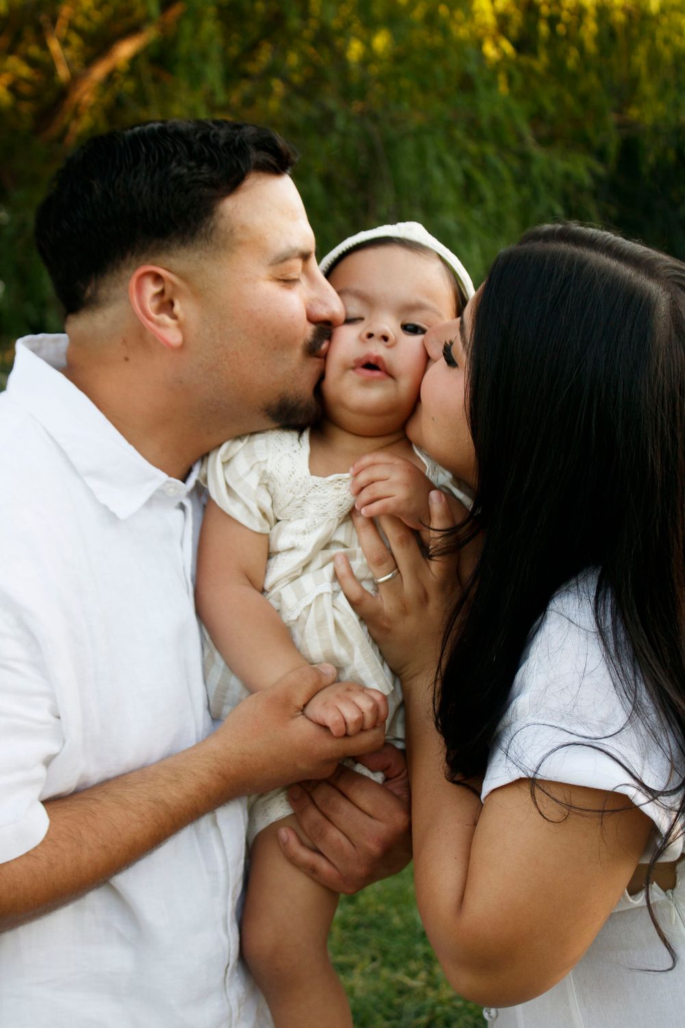 A family of three during a family photo session at Willow Tree Park in Canyon, Texas