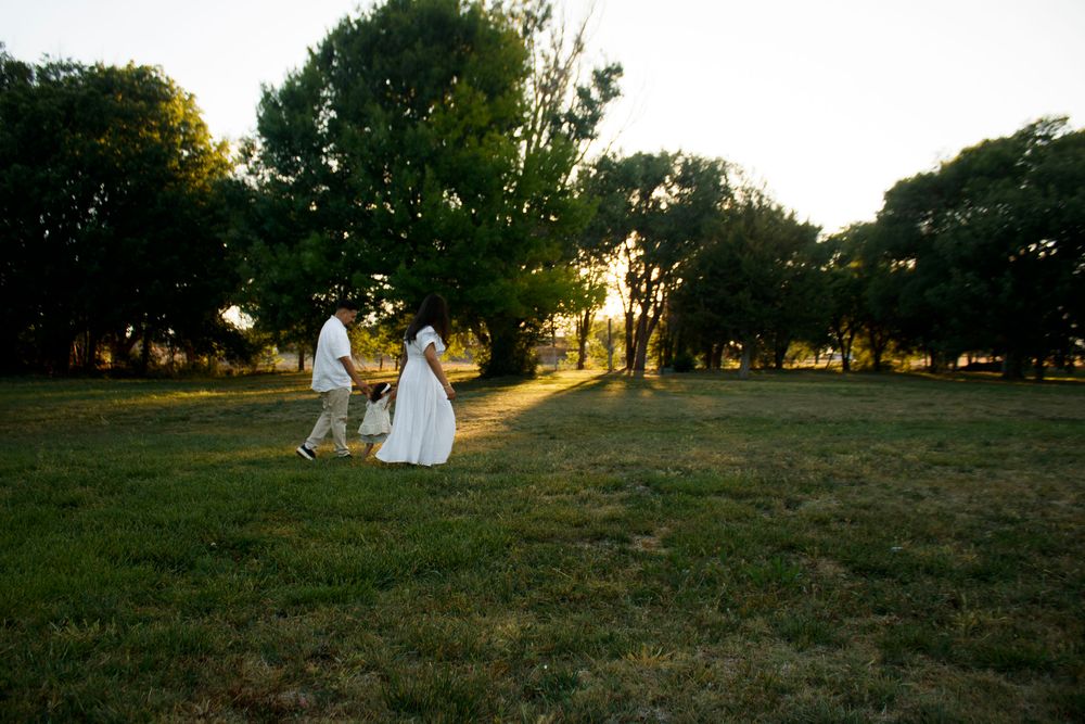 A family of three during a family photo session at Willow Tree Park in Canyon, Texas