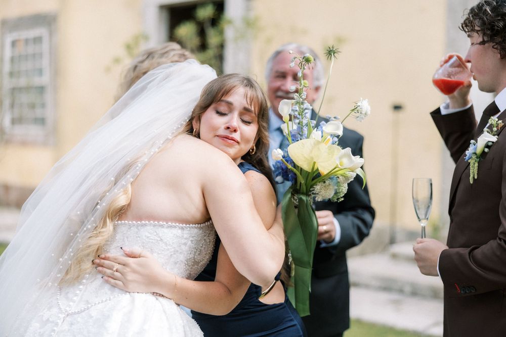 Emotional hugs and congratulations at Quinta do Torneiro wedding