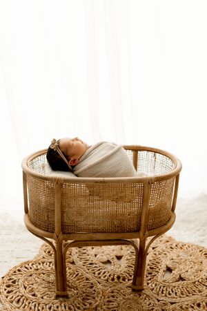 Boho newborn lifestyle photography with neutrals during newborn photoshoot in Marion Indiana