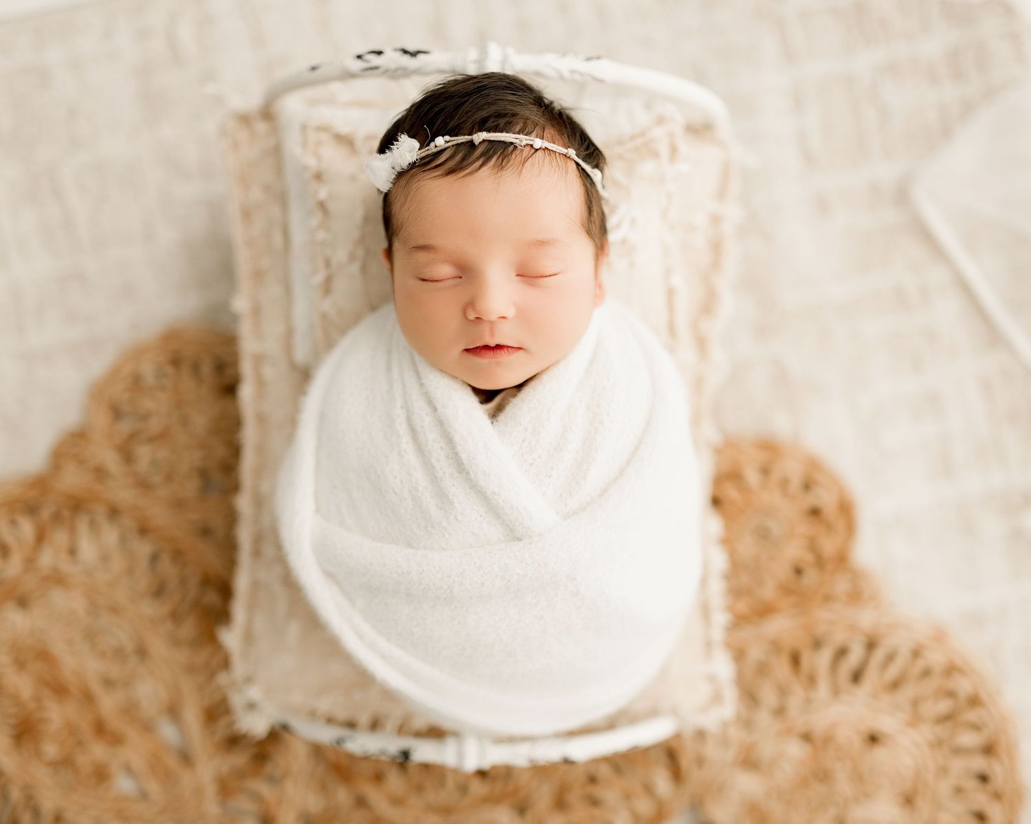Indiana newborn lifestyle photoshoot with baby girl in Tiffany Bergamino Photography's studio in Marion Indiana