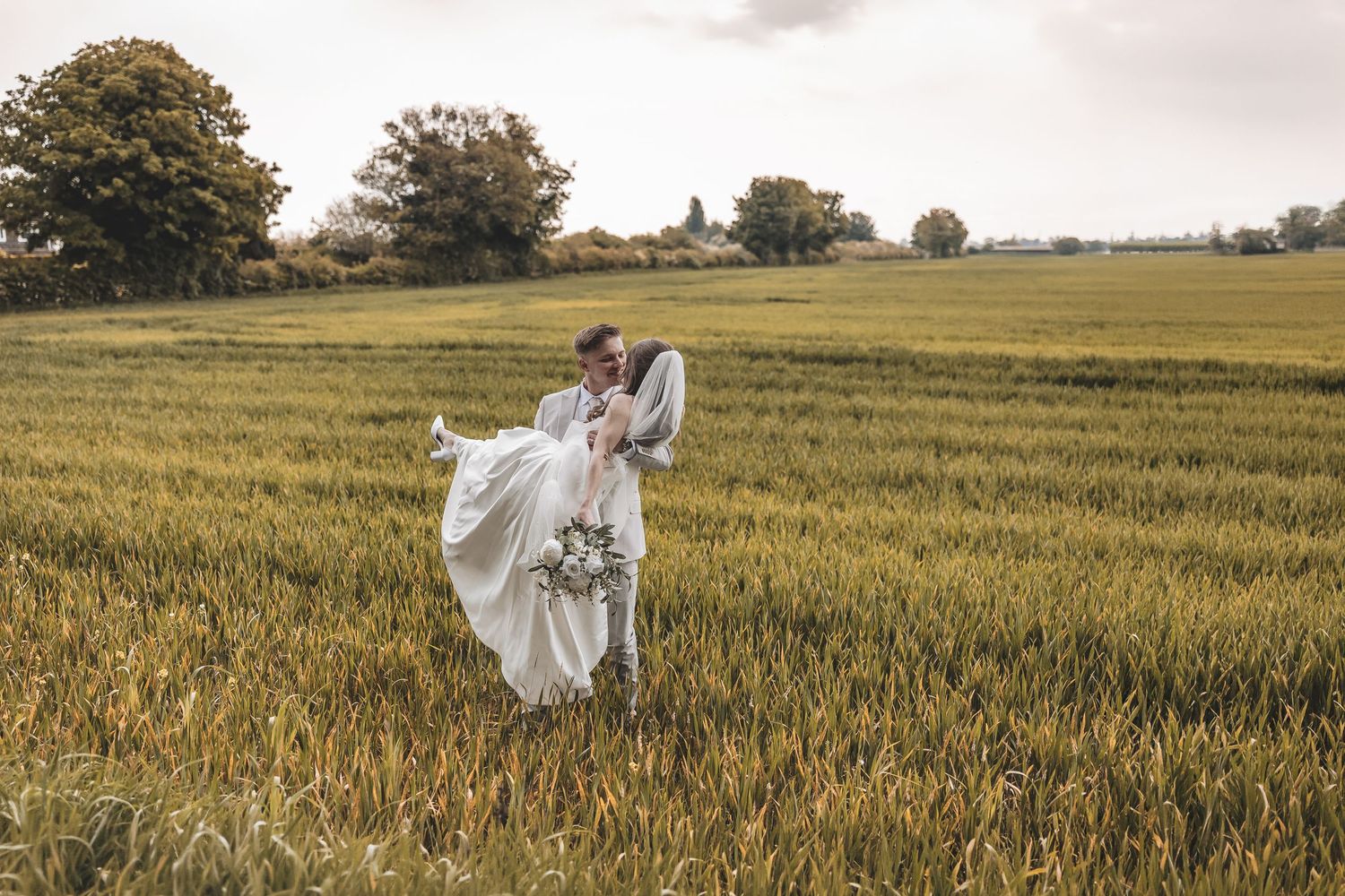 Real unobtrusive wedding couple moment during couple portraits.