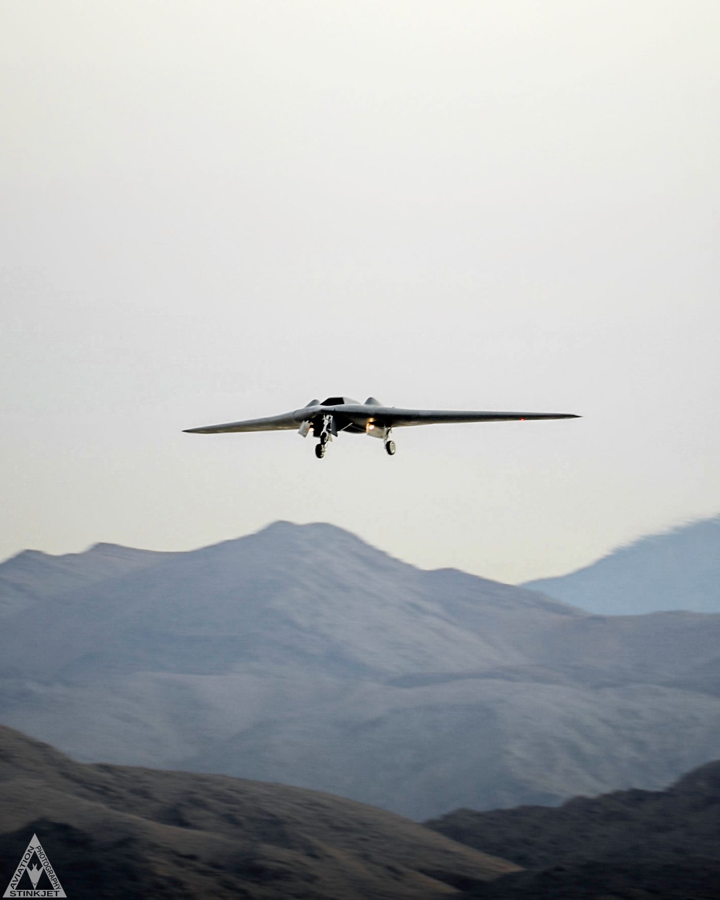 an RQ-170 Stealth Drone flies over Nevada mountains just after takeoff