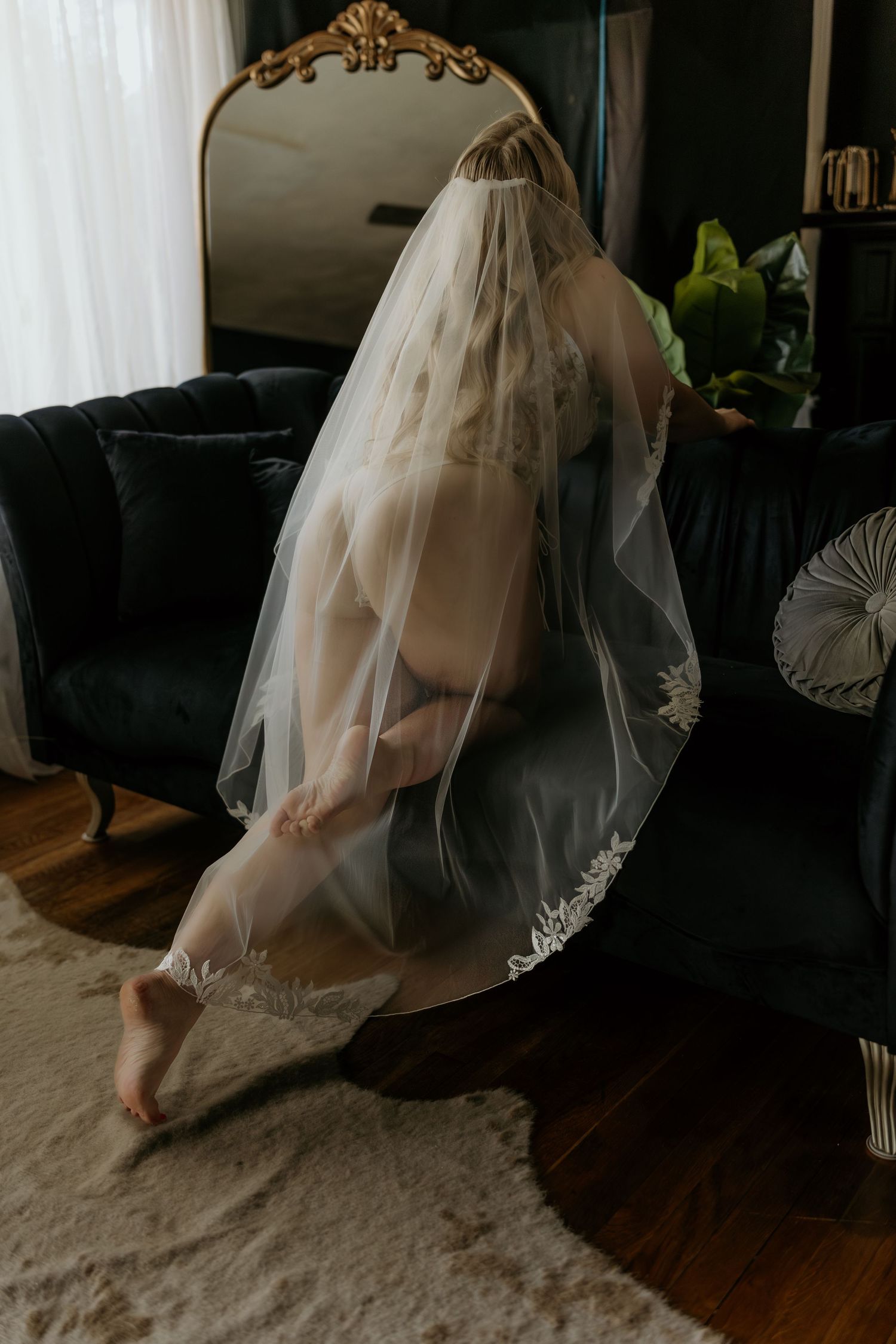 A sequence of photos showing the flowing movement of a wedding dress and veil against a dark interior background.