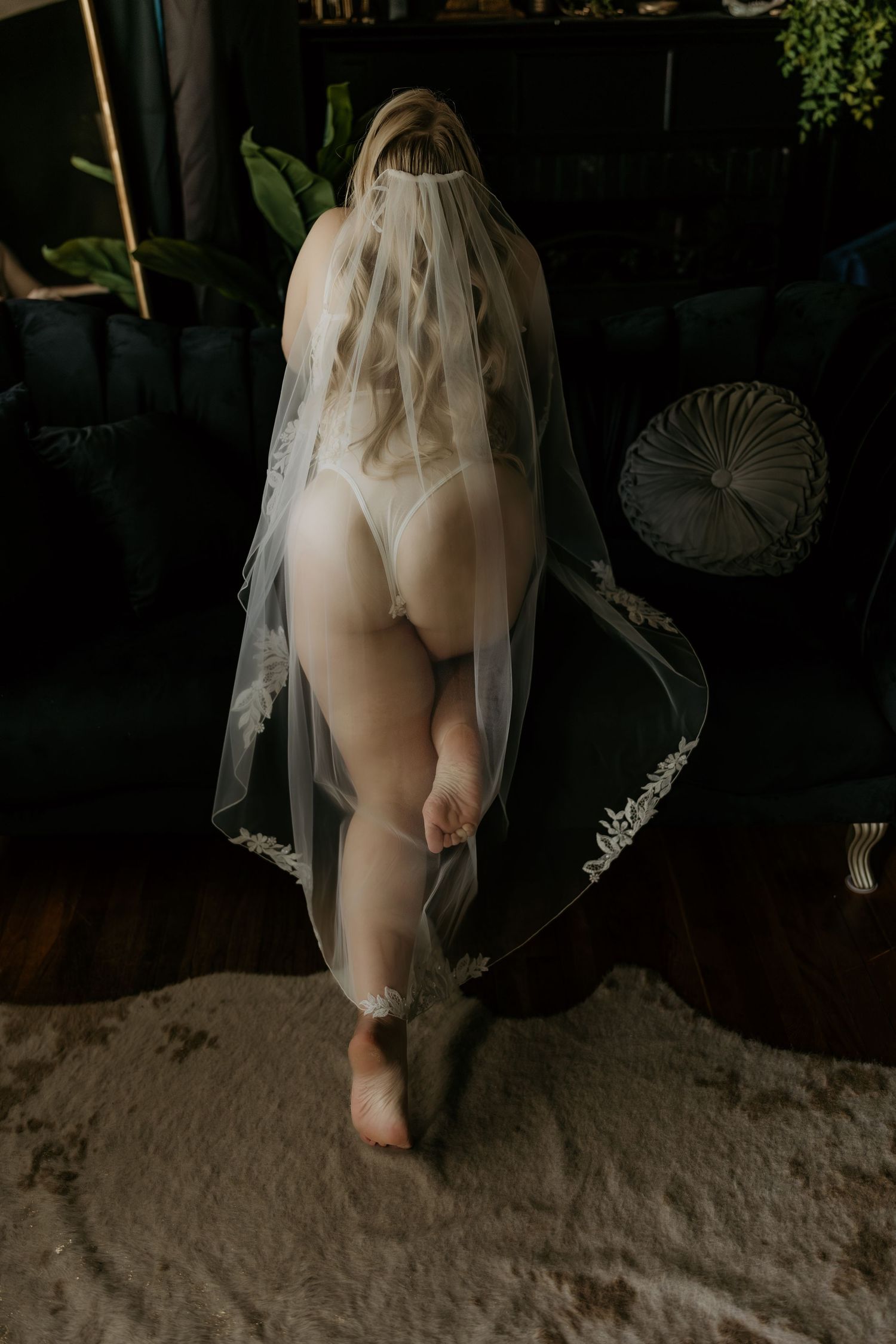 Series of artistic photographs showing delicate lace and tulle details against dark moody background.