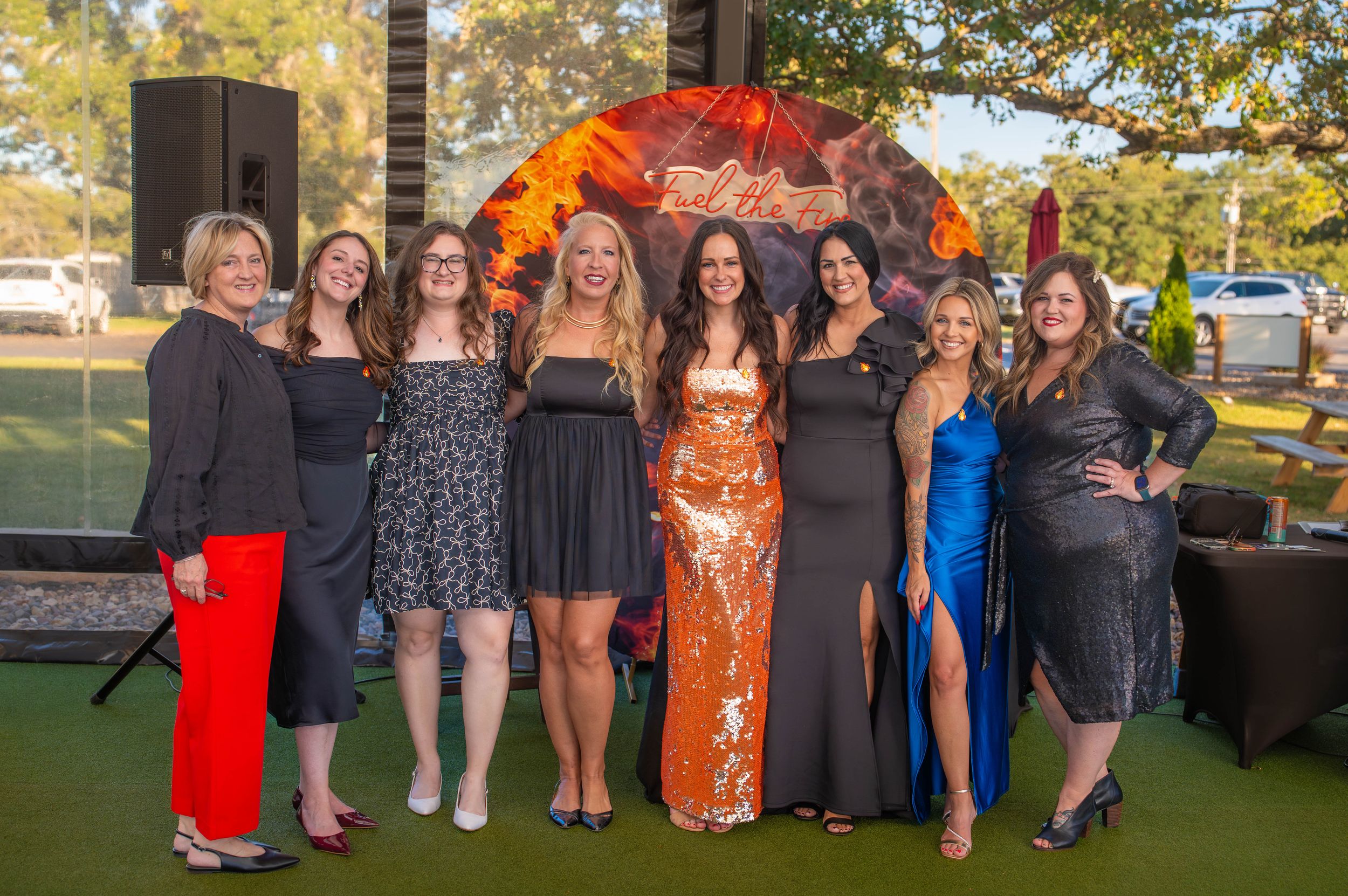 A group of friends pose together at an outdoor event.  Quad Cities Event Photography