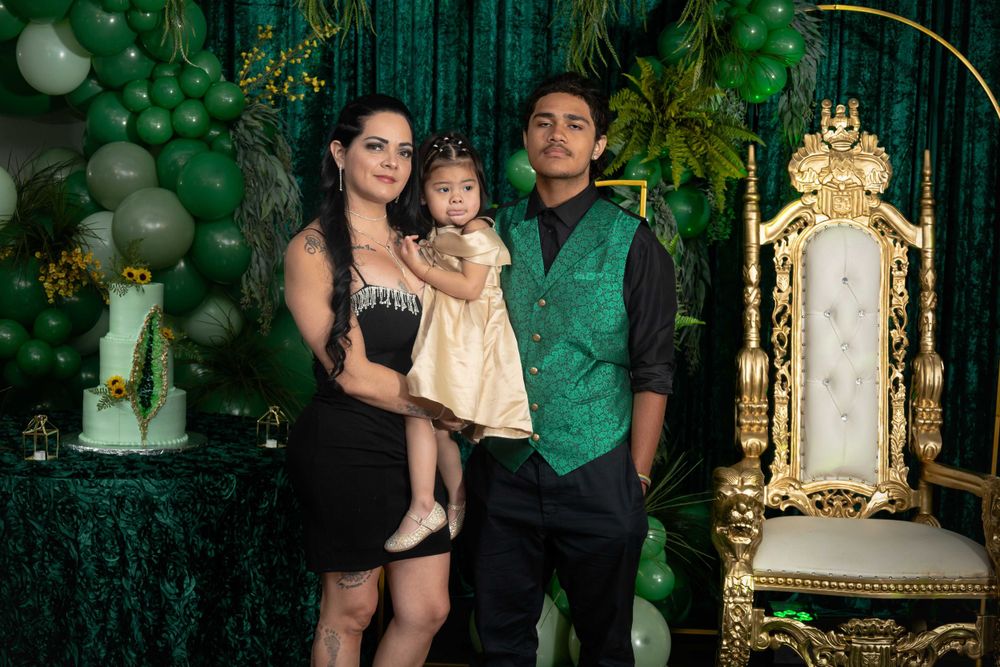 Festive celebration scene with emerald green decor and an ornate gold throne backdrop.
