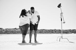 couple standing at a lake