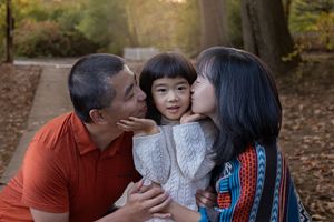 A series of candid family moments captured in autumn showing affection and connection between loved ones.