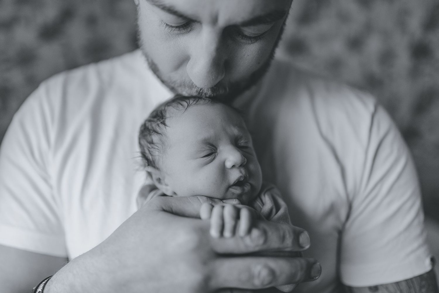 Intimate black and white photo series of parent holding sleeping newborn. Photographer. Hull. East Yorkshire. Photography