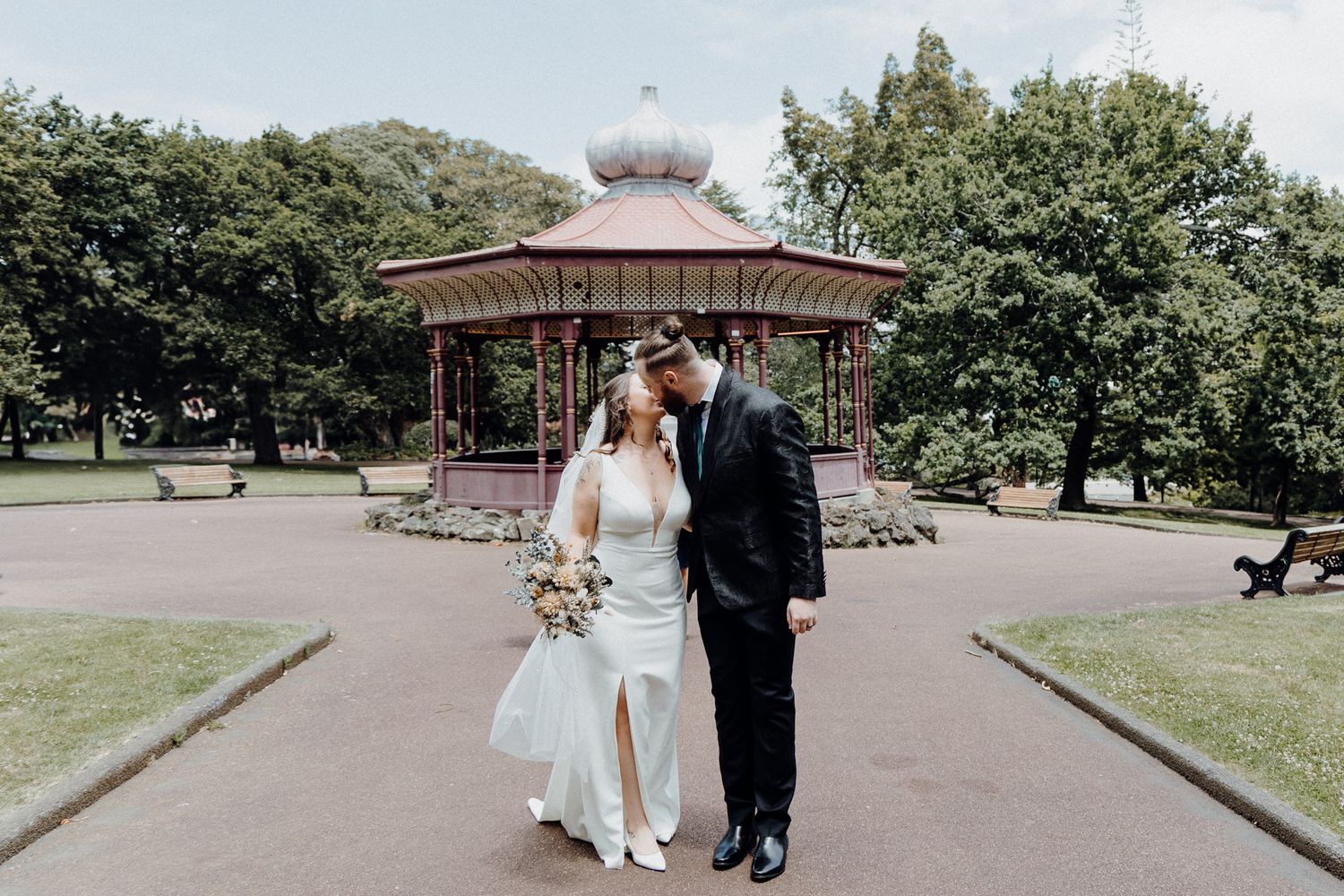 Newly-wed couple shares an intimate moment, captured by Apertured Media Auckland Wedding Photographer.