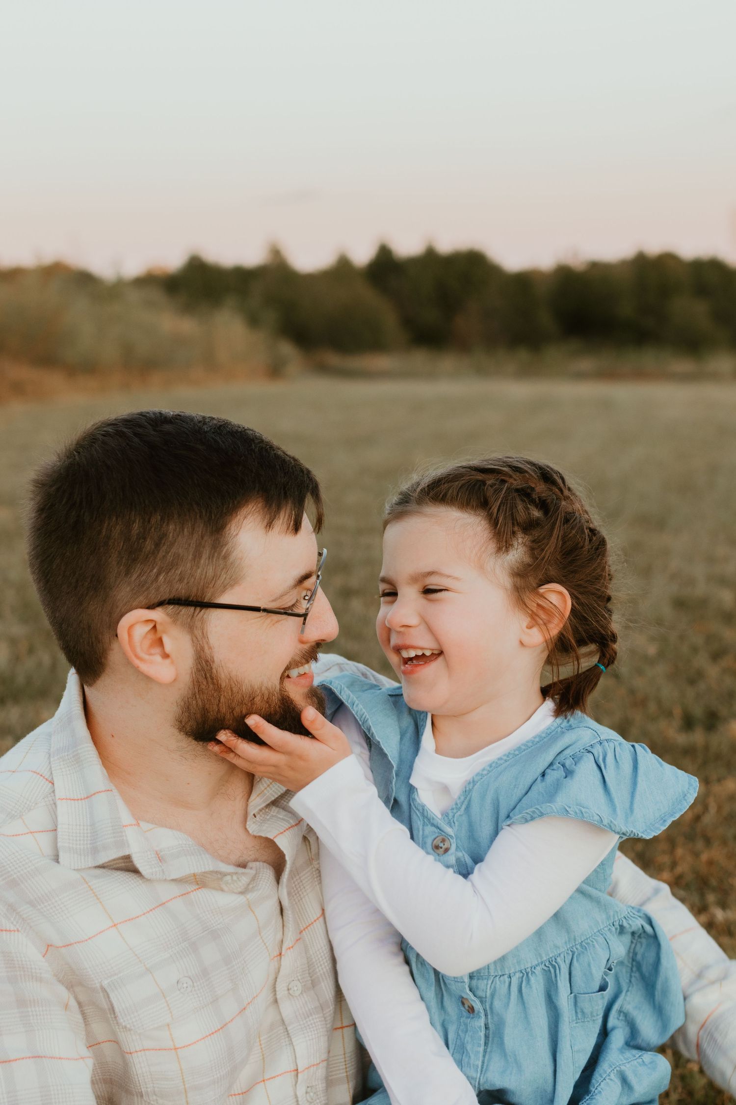 Inman family photoshoot with dad and daughter during family photoshoot at golden hour