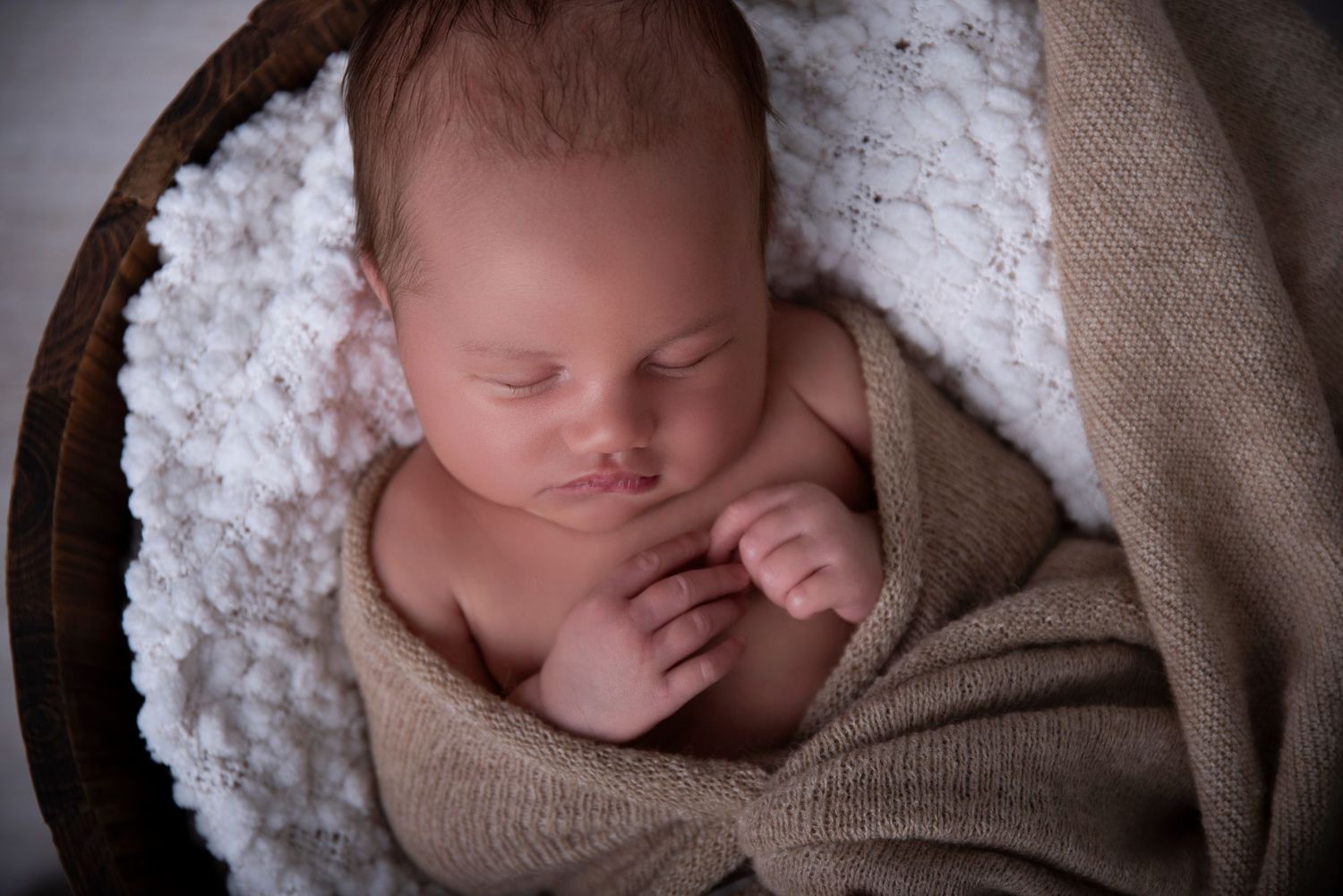 handsome little boy posed in a bucket by genesis Imagery Gold Coast newborn photographer