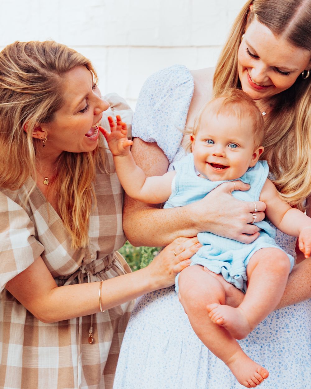 Candid moments of playtime with a baby on a soft blanket.
