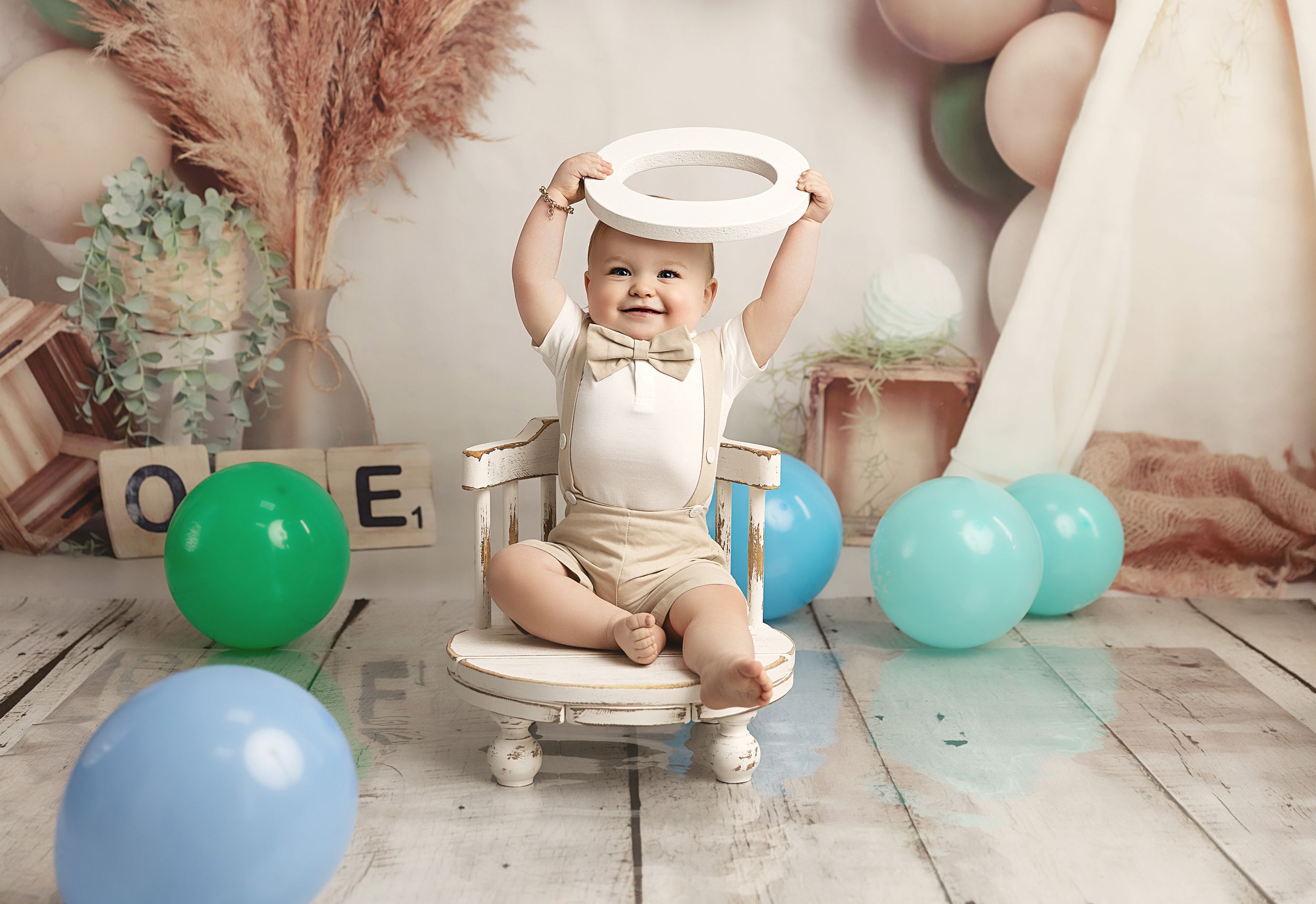 Picture of little boy at his cake smash celebrating one year old birthday party in Coventry