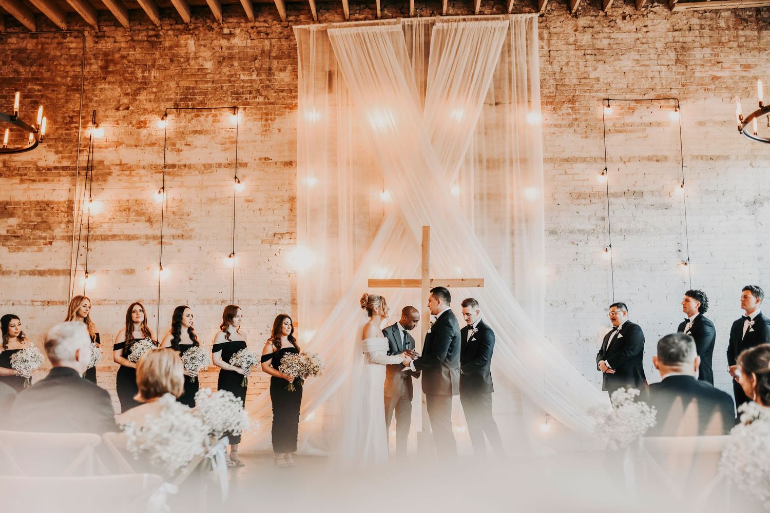 Guests watching emotional Christian wedding ceremony