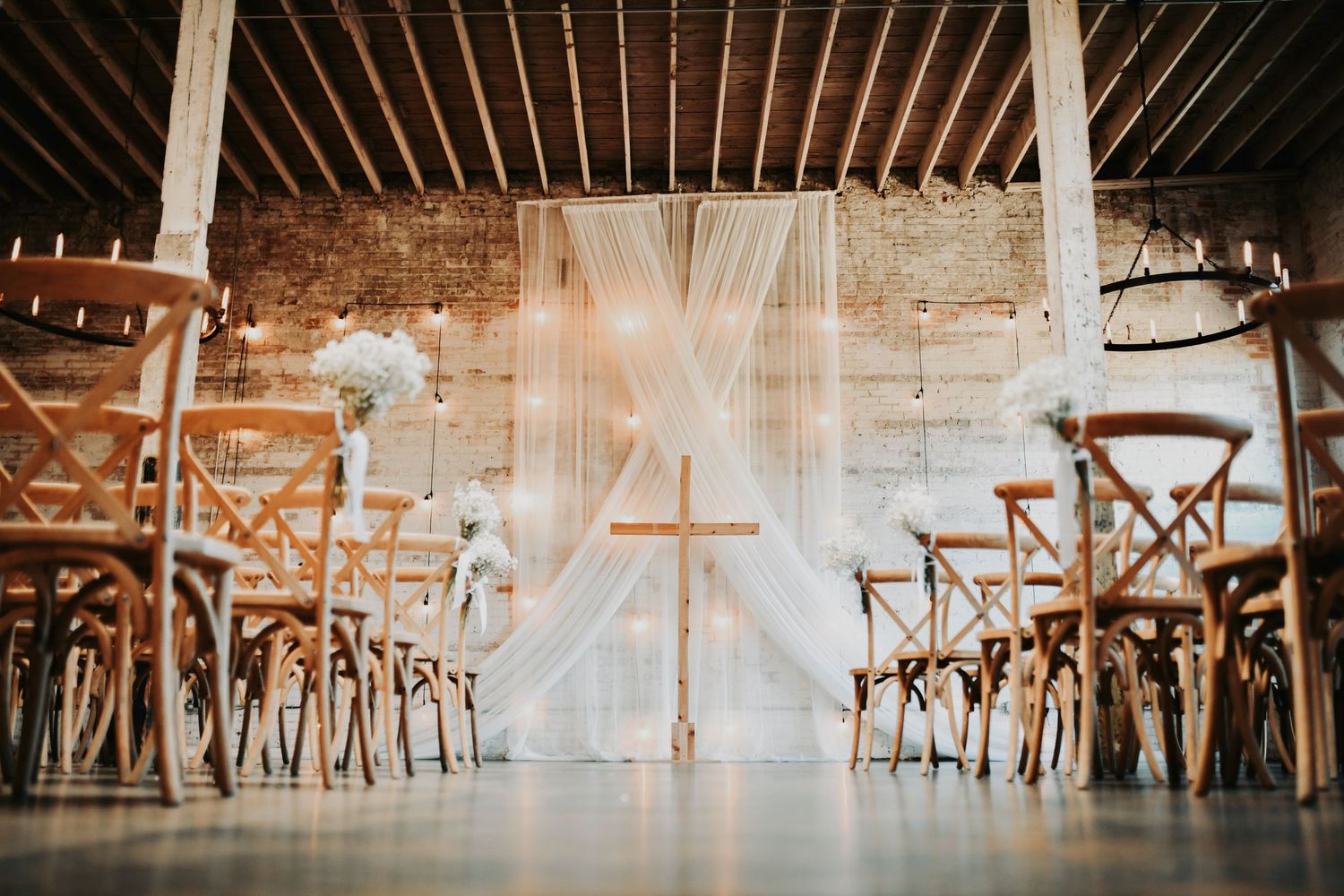 Ceremony site at Brake & Clutch Warehouse styled for modern black-tie wedding