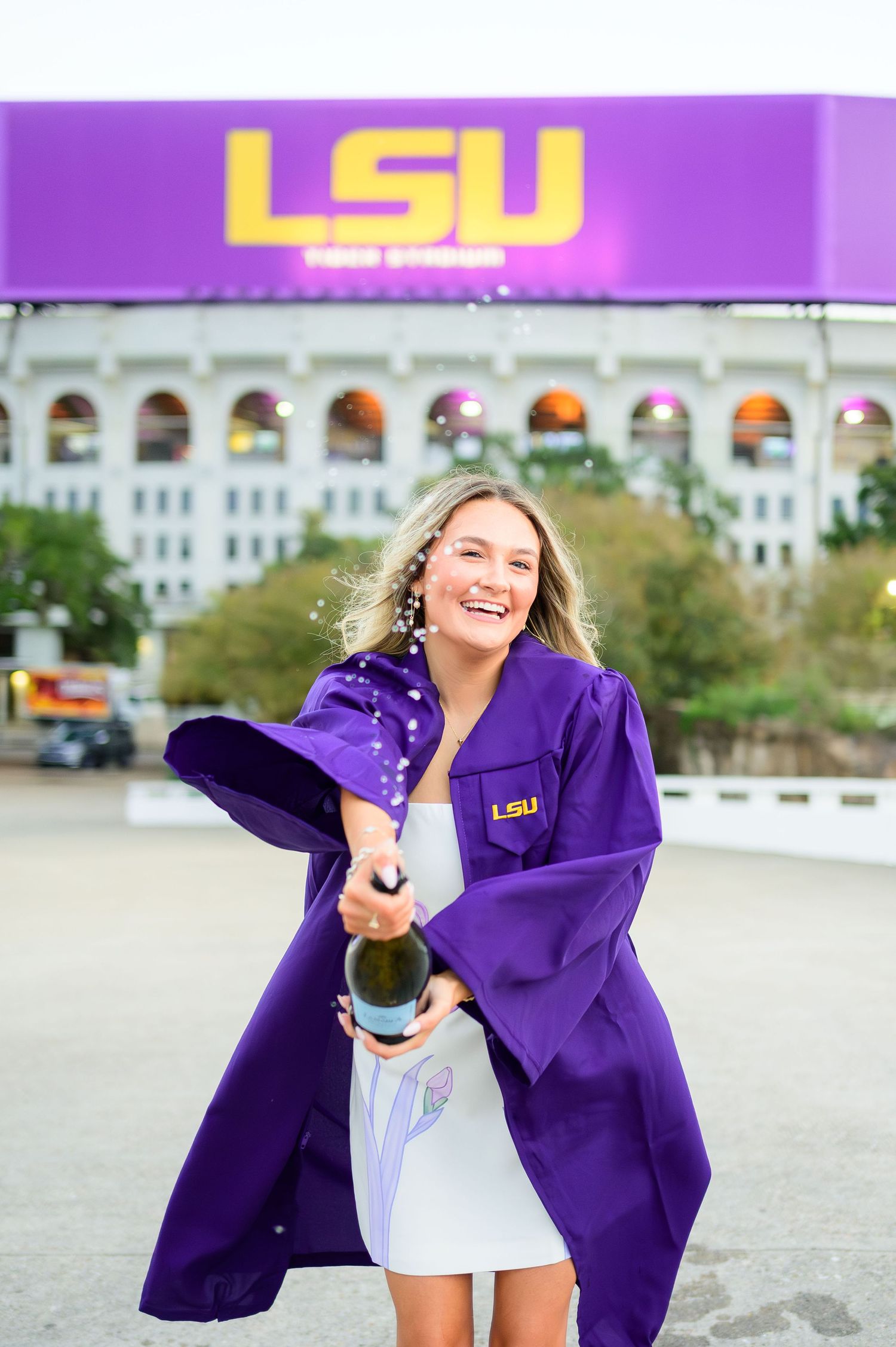 A person in a purple LSU jacket poses playfully in a series of outdoor photos near campus buildings.