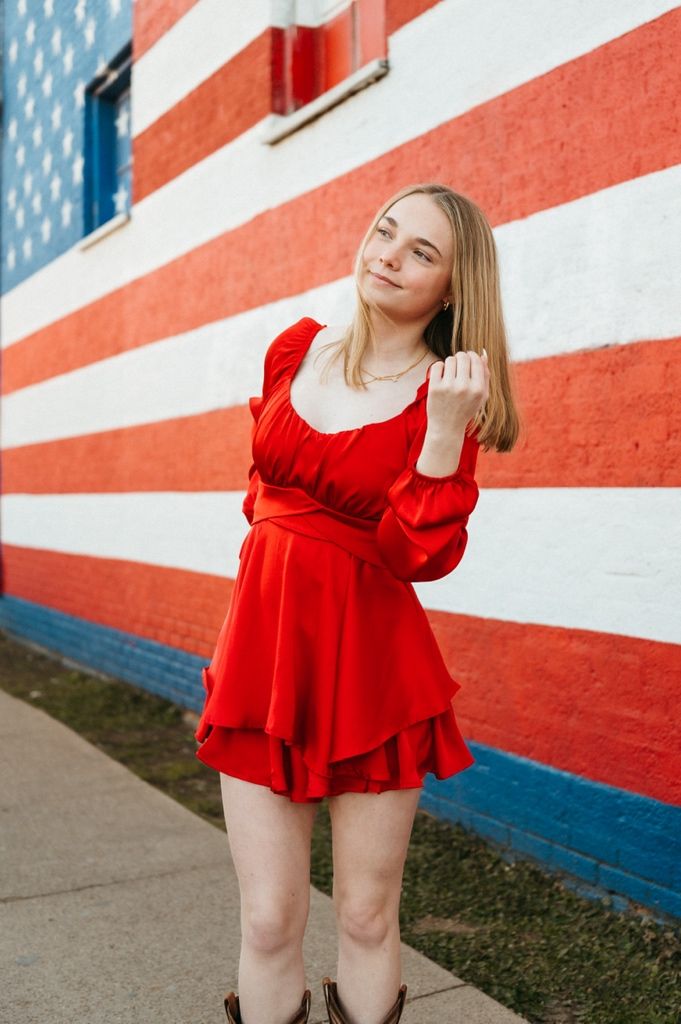 A series of photos showing someone in a red ruffled dress posing against a red and white striped wall background.