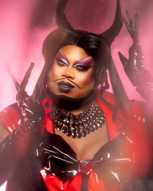 Dramatic fashion portraits in pink and red lighting showcase bold makeup and dark glamorous styling with statement jewelry.
