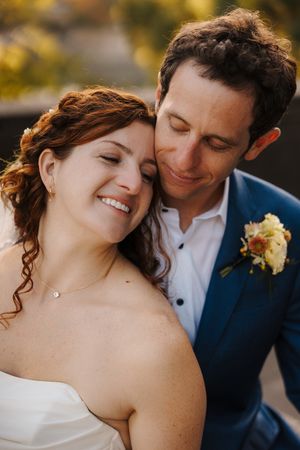 A romantic wedding couple shares intimate moments in a series of close-up shots during golden hour.