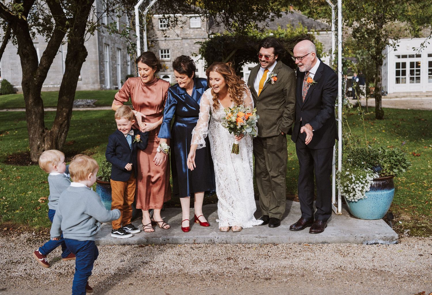 A collage of outdoor wedding photos showing people gathered in a garden setting for a celebration.