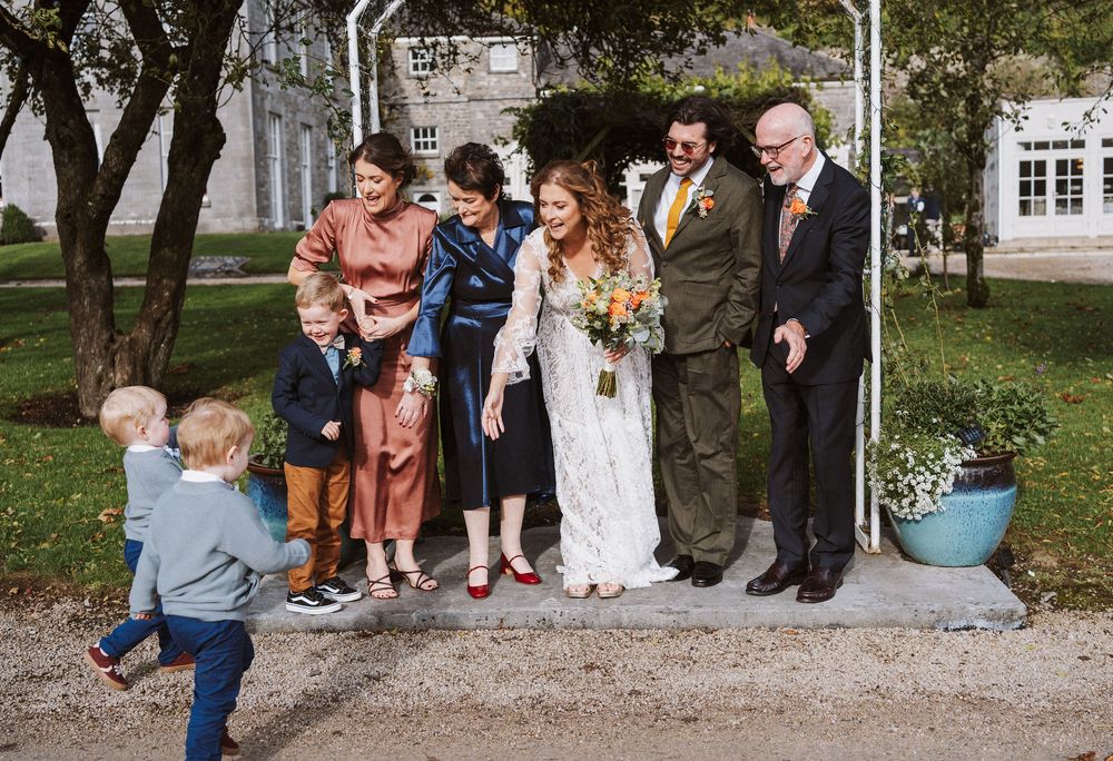 A collage of outdoor wedding photos showing people gathered in a garden setting for a celebration.