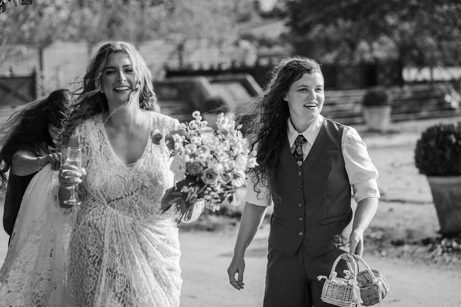 A collection of candid black and white wedding photos showing joyful moments and celebrations.