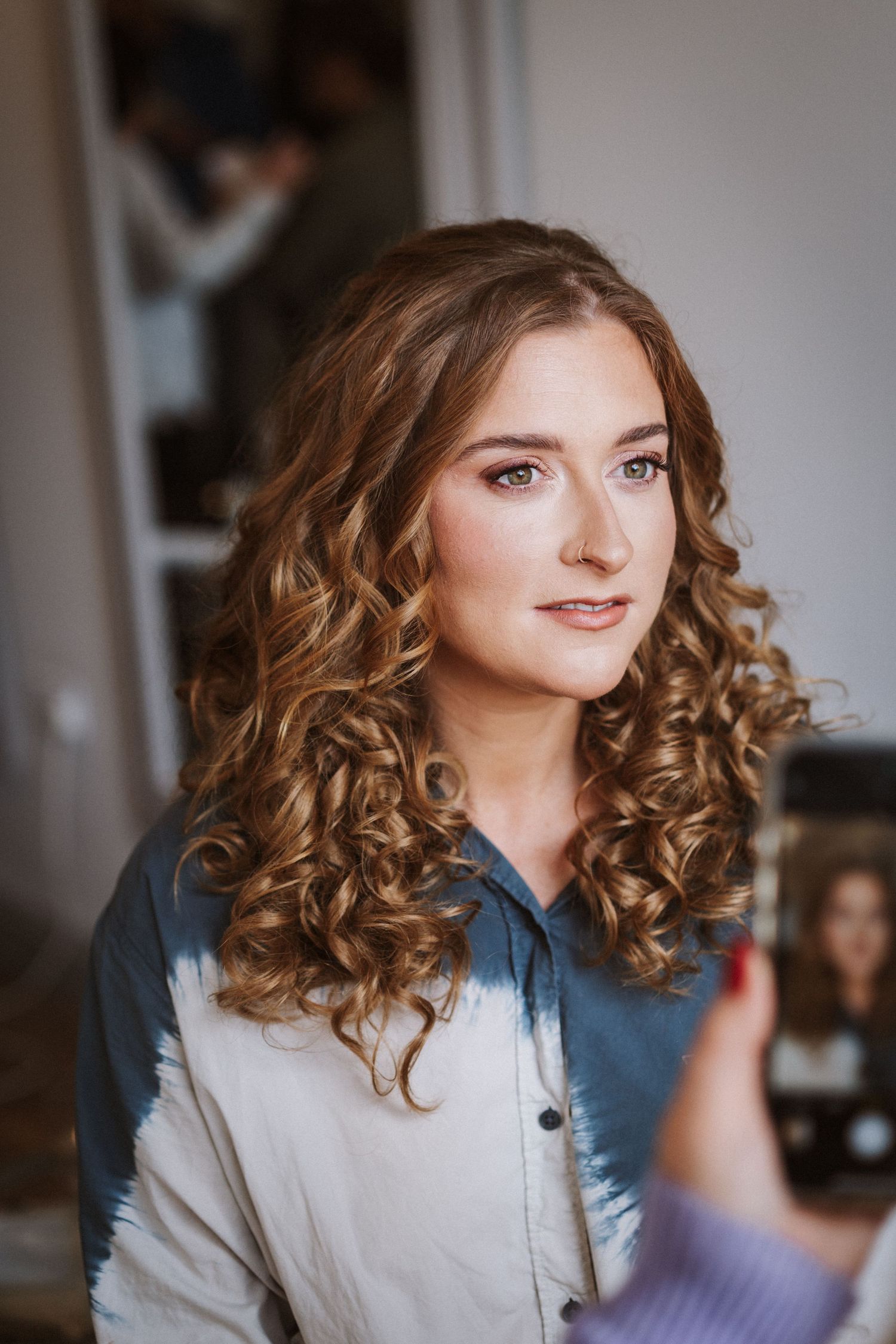 A series of portraits showing curly brown hair and a denim shirt against a light background.