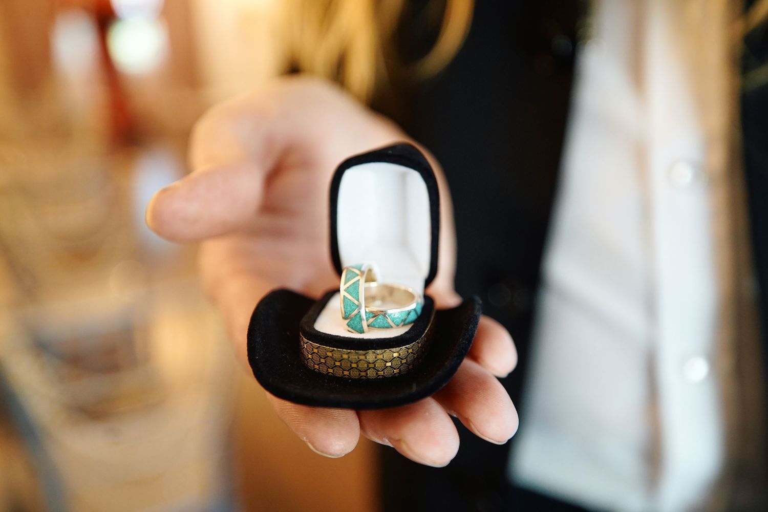 Detail wedding photo of turquoise wedding rings
