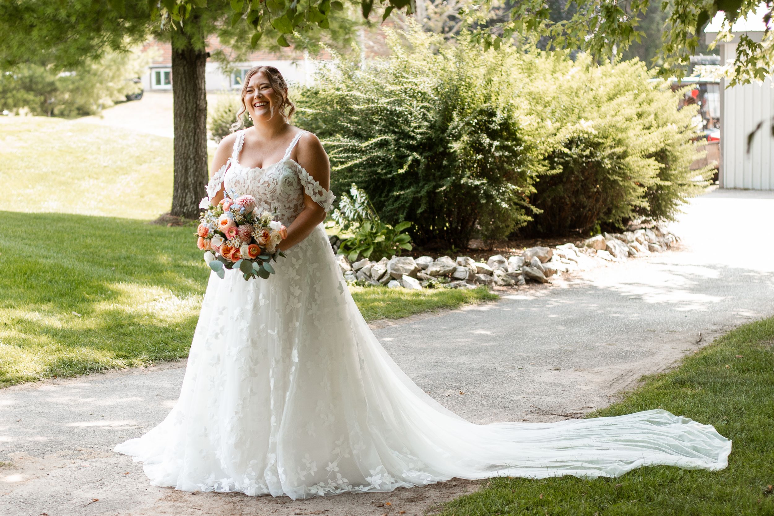 A bride during her first look at Strathroy Caradoc Sands Golf Club, set among beautiful lush landscaping.