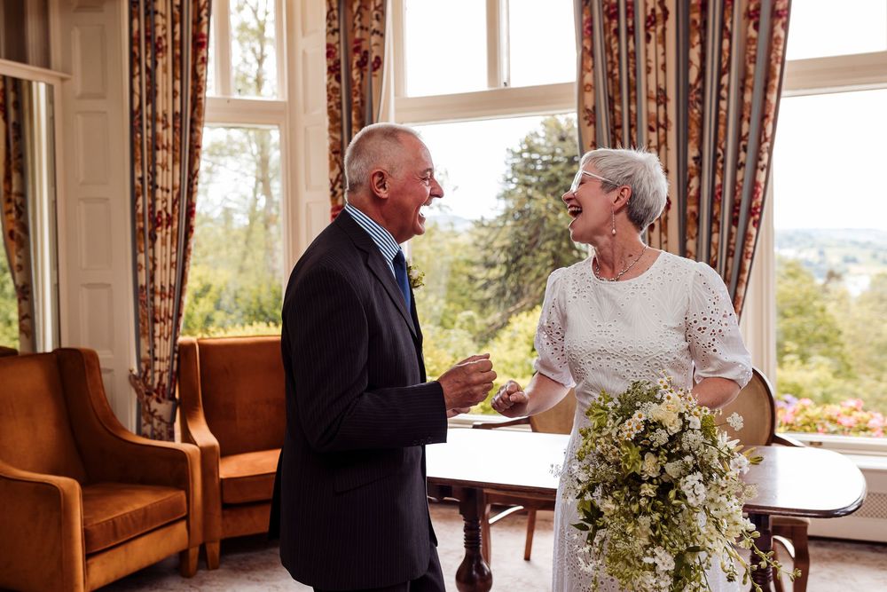A series of four wedding photos showing tender moments between a couple with floral arrangements and window light.