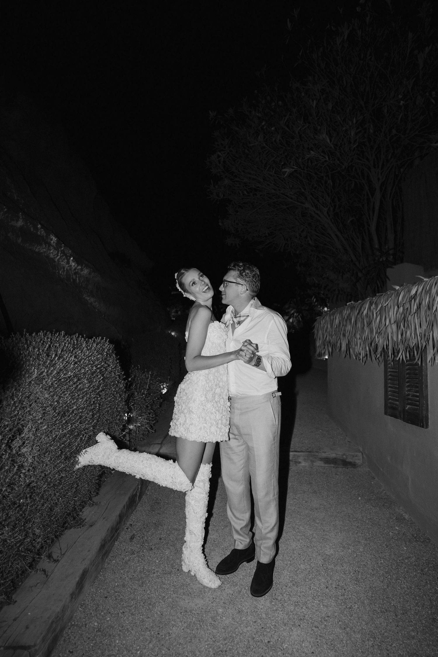 bride in Emma Beaumont dress laughing with groom at amante ibiza