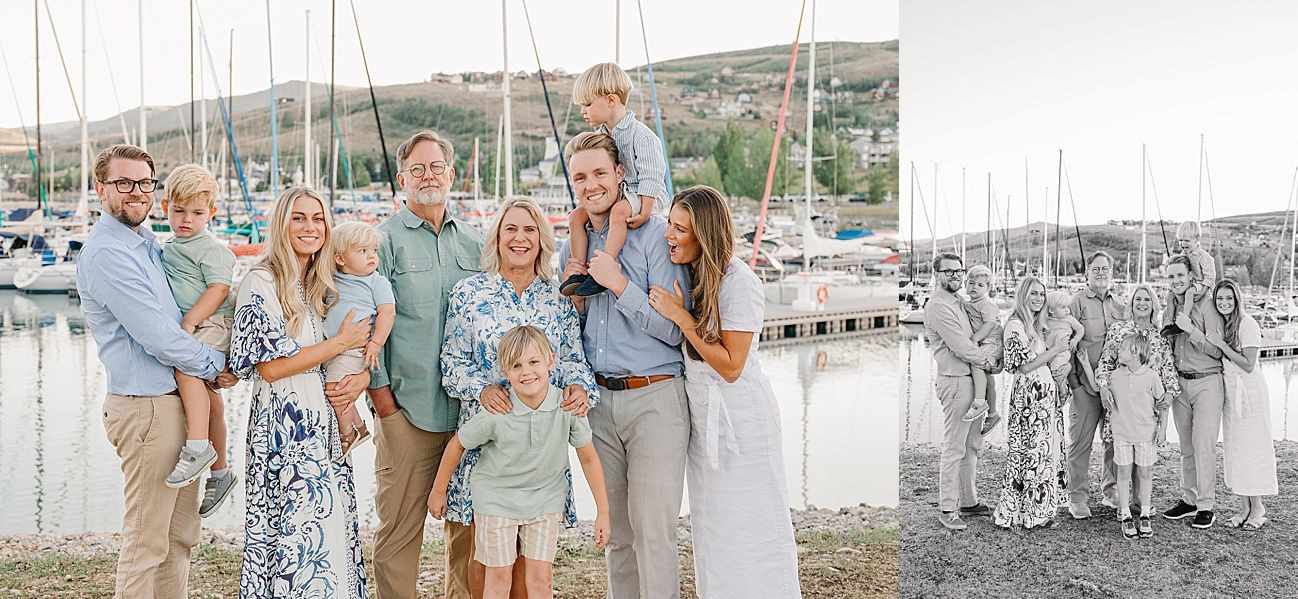 A group in coordinated blue and white outfits poses together at a marina with boats and docks in the background.