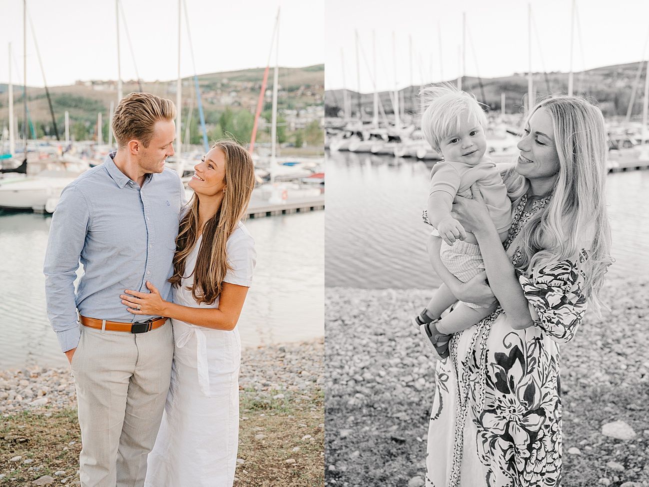 A couple shares a tender moment together at a marina with boats and hills in the background.