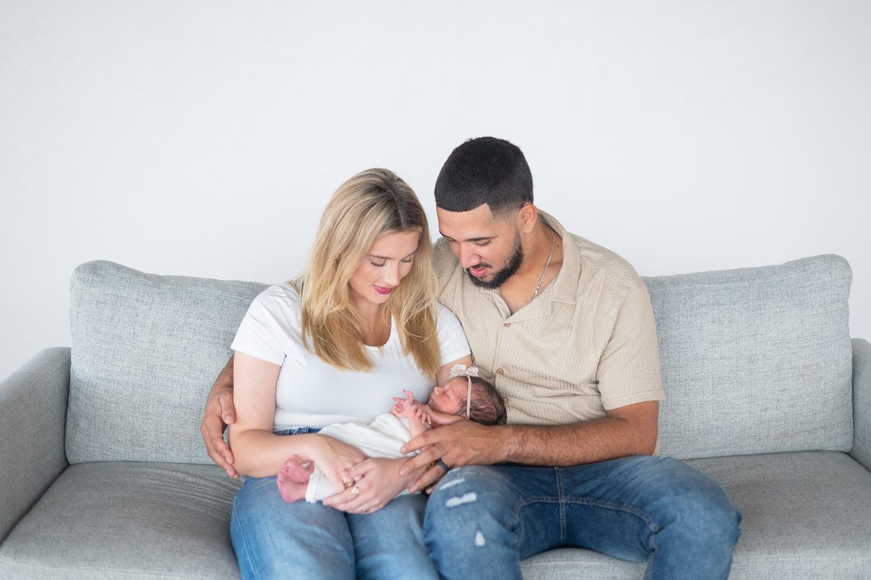 Newborn baby girl portrait session at Natural Light Studio with parents and grandparents by Bartlesville Newborn Photographer Kristi Bray