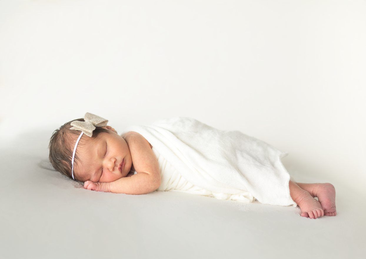 Newborn baby girl portrait session at Natural Light Studio with parents and grandparents by Bartlesville Newborn Photographer Kristi Bray