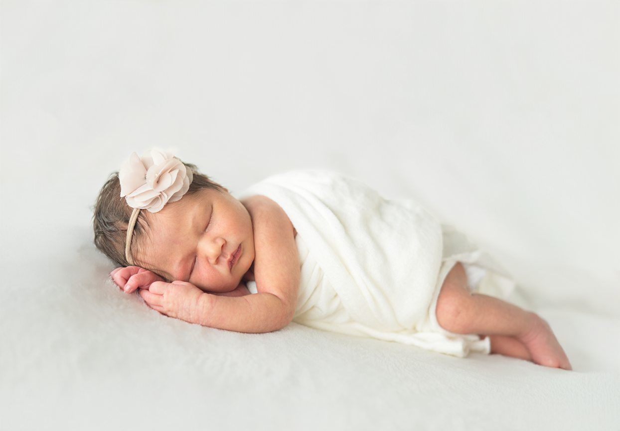 Newborn baby girl portrait session at Natural Light Studio with parents and grandparents by Bartlesville Newborn Photographer Kristi Bray